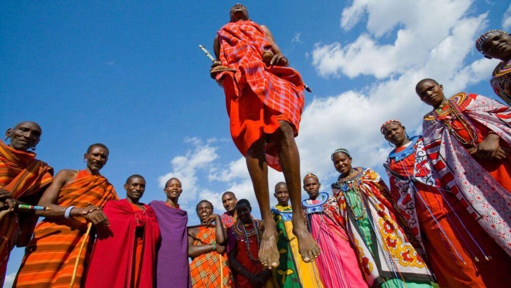 The man of a tribe Masai shows ritual jumps.